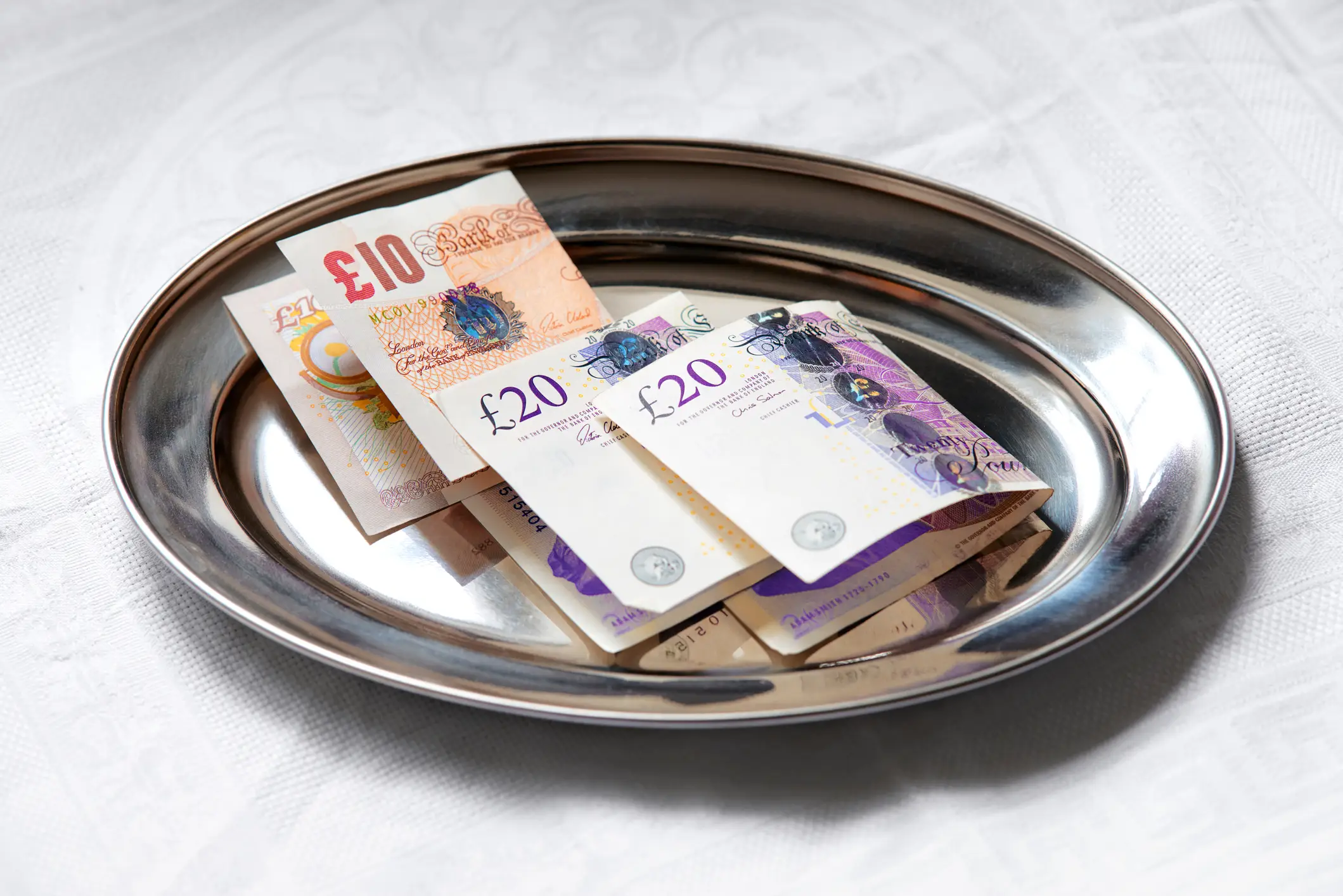 Paying a tip by cash isn't as common as it used to be. (Getty Stock Photo)