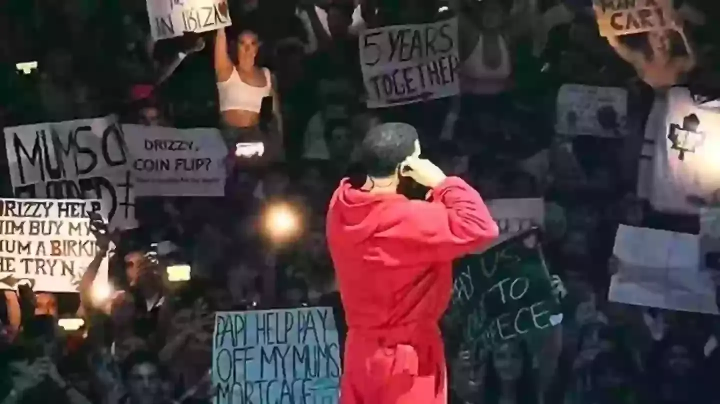 A lot of people bring signs to Drake concerts asking him for things (X)