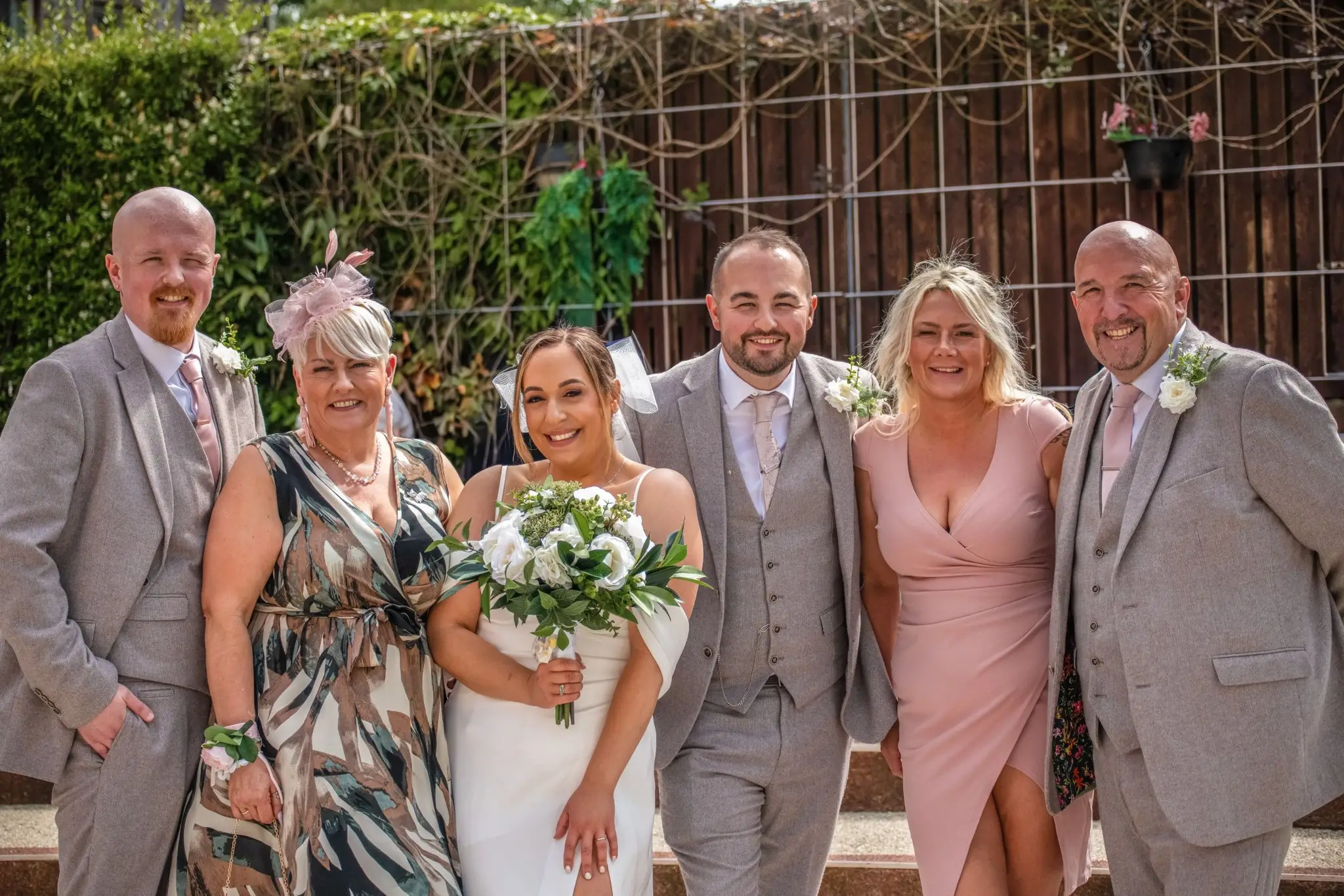A picture of Nadia and Nathan with family on their wedding day, taken by their friend Georgia Cooper (Georgia Cooper/PA Real Life)
