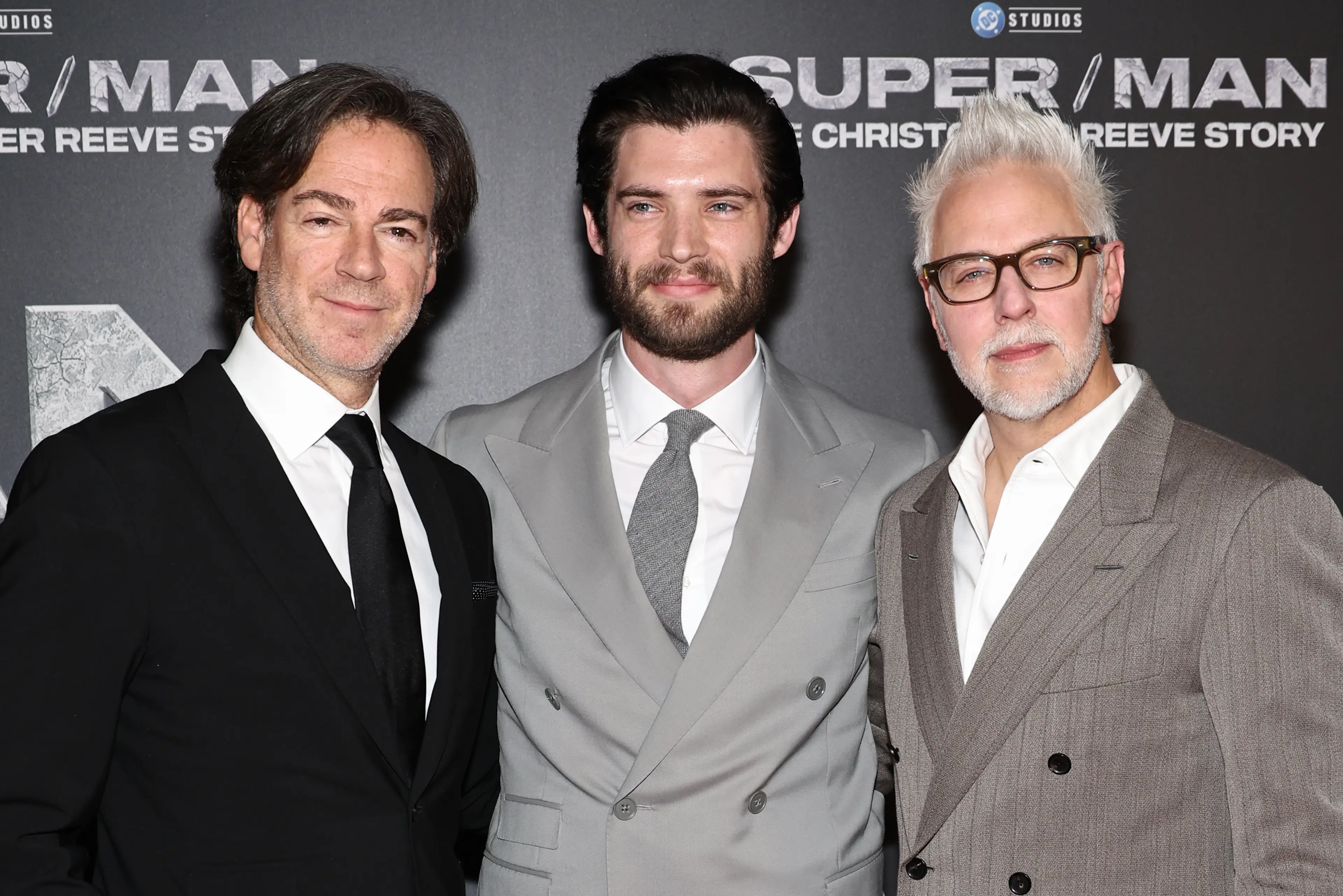 David Corenswet flanked by James Gunn and Peter Safran, the co-CEOs of DC Studios (Jamie McCarthy via Getty Images)