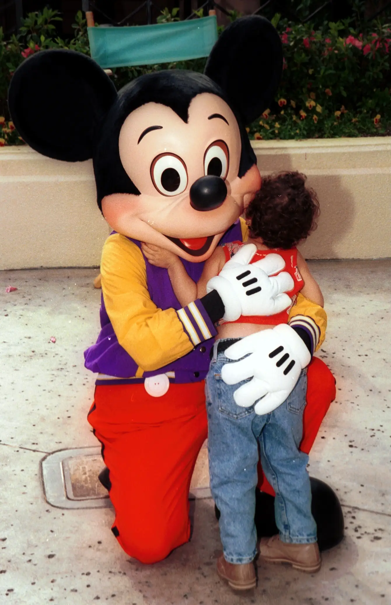 Disney mascots never break from the hug first (Peter Bischoff/Getty Images)