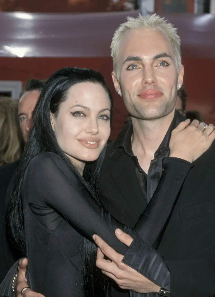 Jolie and her brother locked lips on the red carpet (Jim Smeal/Ron Galella Collection via Getty Images)