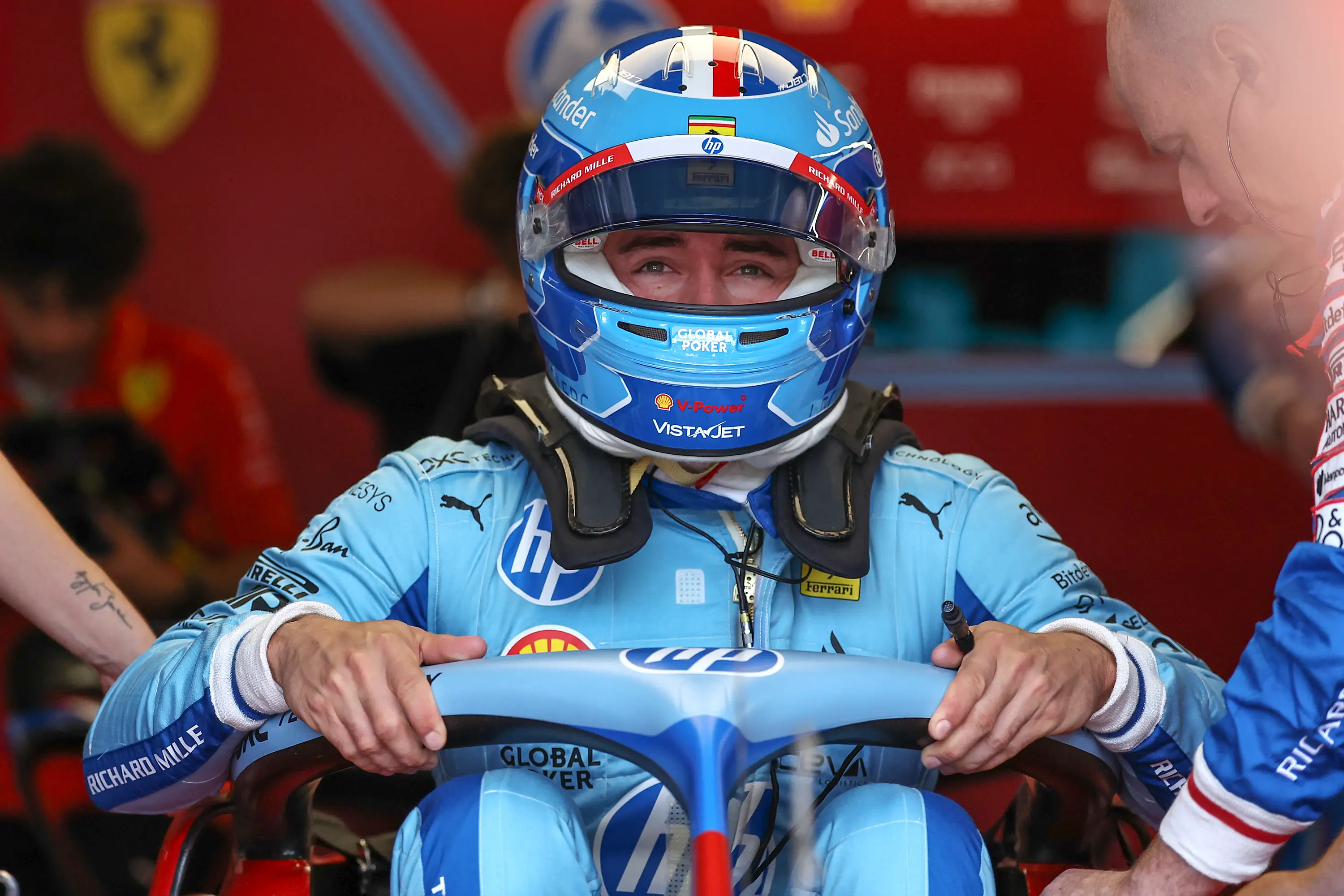 Charles Leclerc in blue. (Qian Jun/MB Media/Getty Images)