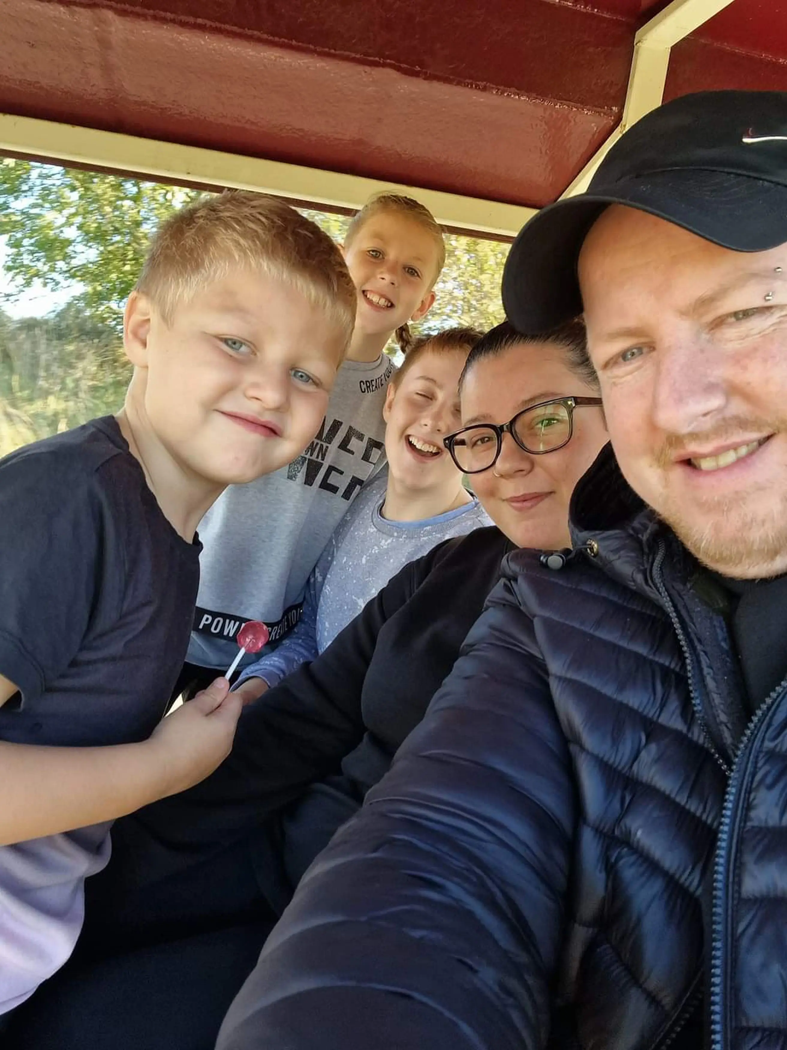 Robert Mansfield with partner Stephanie Scott and their kids.