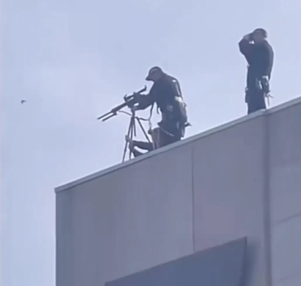 Marksmen were see in Edinburgh amid the Queen's procession.