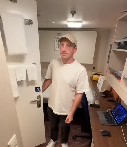 Bryan in his Royal Caribbean cabin. (YouTube / BryanJamesCruises)
