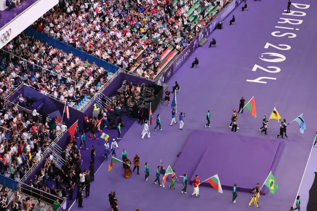 Athletes took to the field to celebrate the Olympic games. (Dan Mullan/Getty Images)