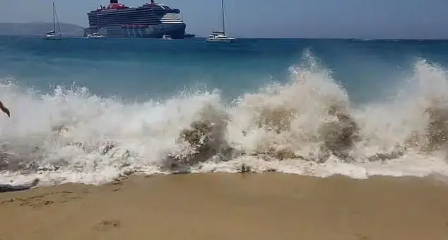 Two people have reportedly been left injured by the force of the wave. (Facebook/Takis Papadakos)