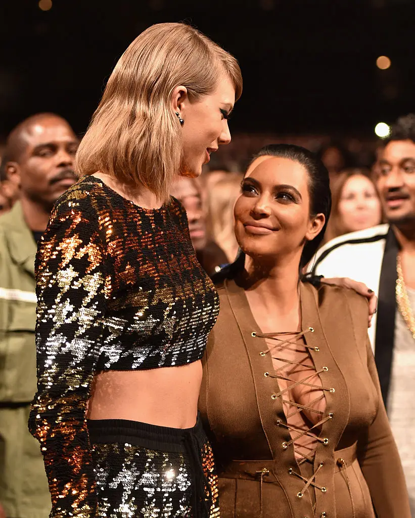 Kim Kardashian and Taylor Swift (pictured in 2015) have reportedly been at odds with each other for a bit over a decade (John Shearer/Getty Images)