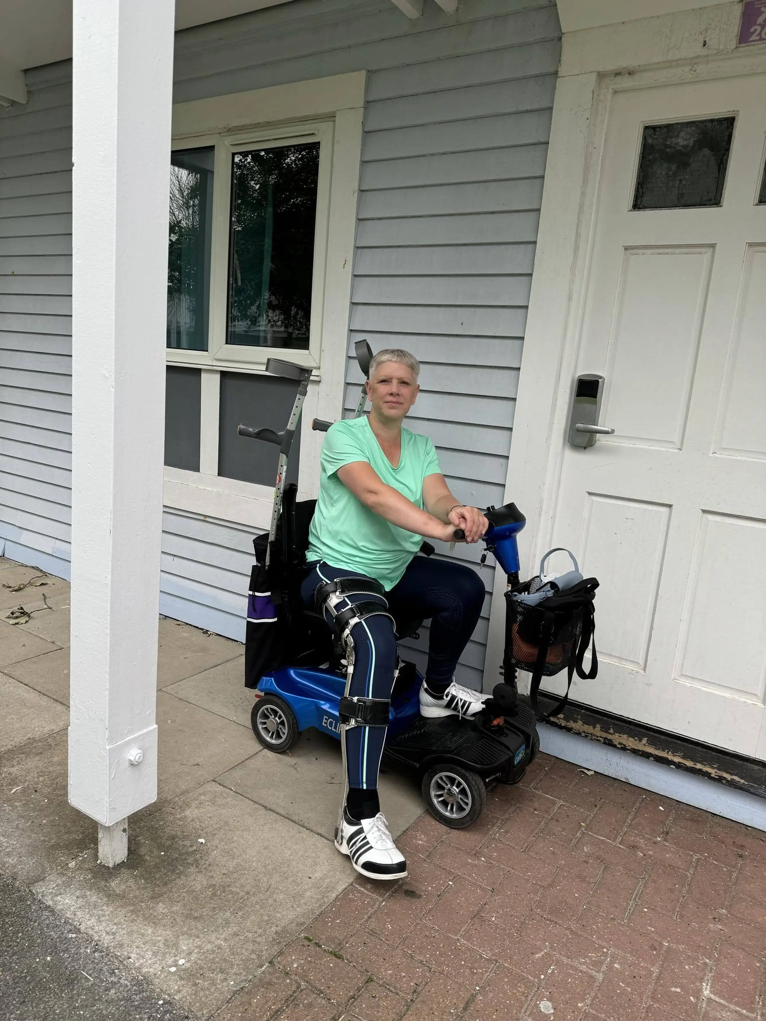 The 42-year-old now gets around on a mobility scooter. (Kennedy News and Media)