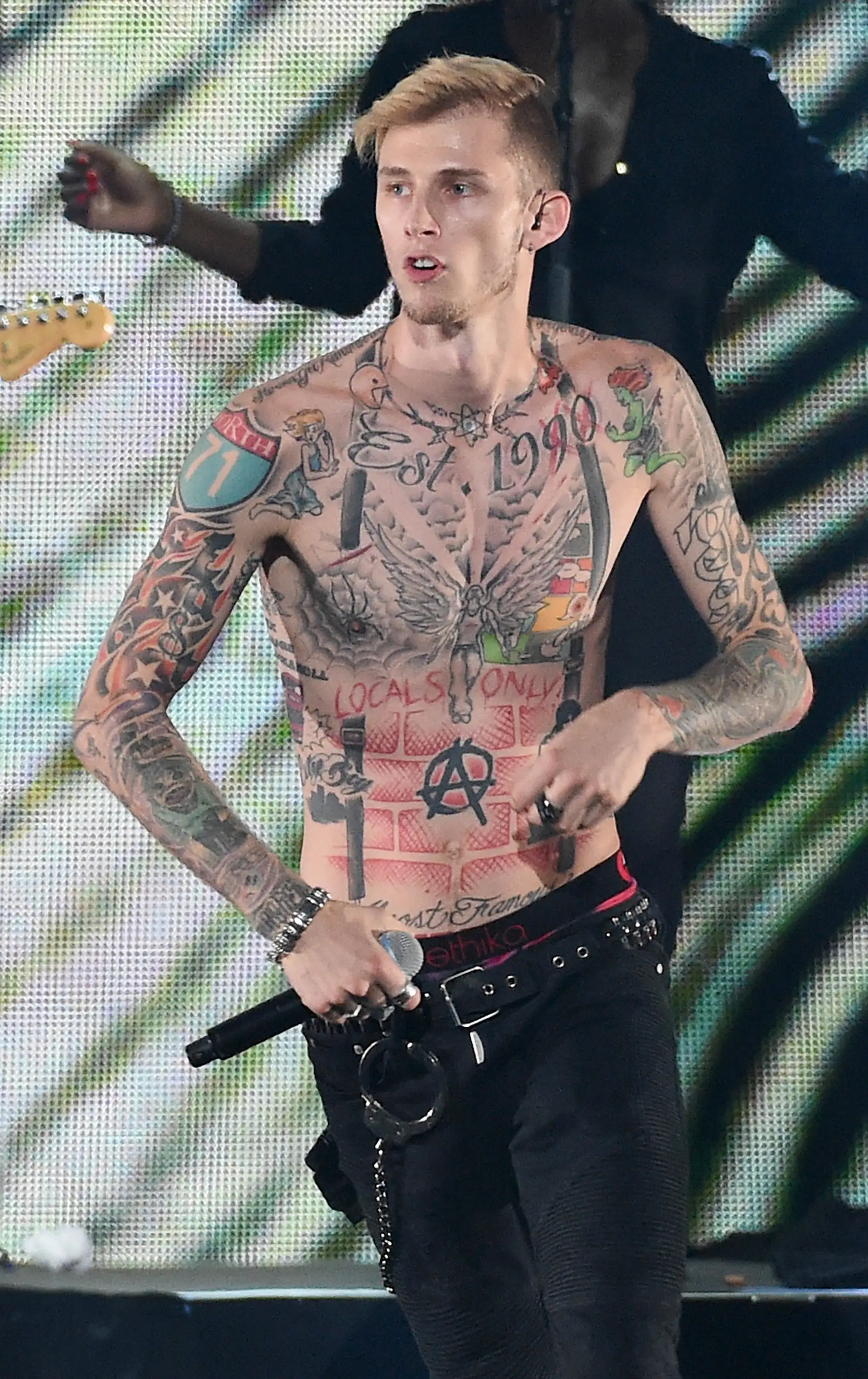 The rapper was covered in a variety of tattoos (Ethan Miller/Getty Images for iHeartMedia)
