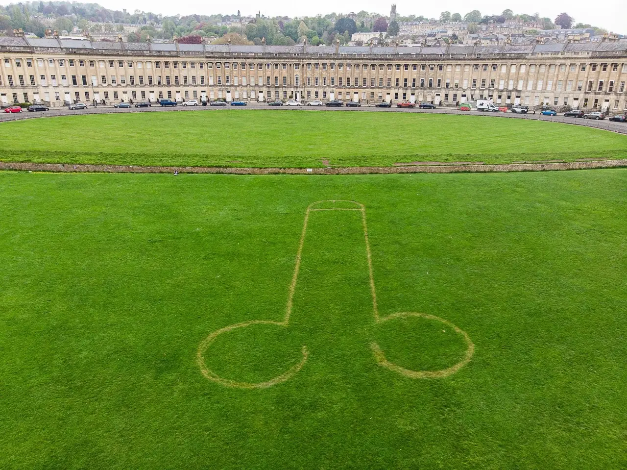 Just days before the Coronation party, cocky pranksters have mowed a large willy into a 'perfect lawn' on one of Britain's most famous streets.