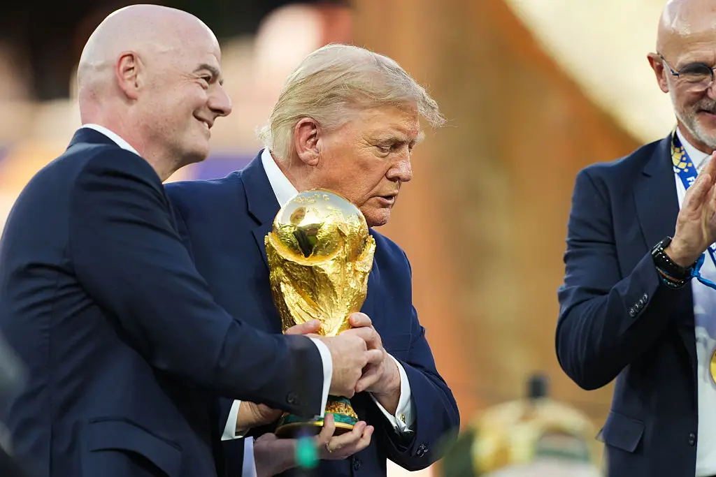 The body language expert noted Trump was less possessive of the World Cup trophy than you might expect for something golden (Andrew Harnik/Getty Images)