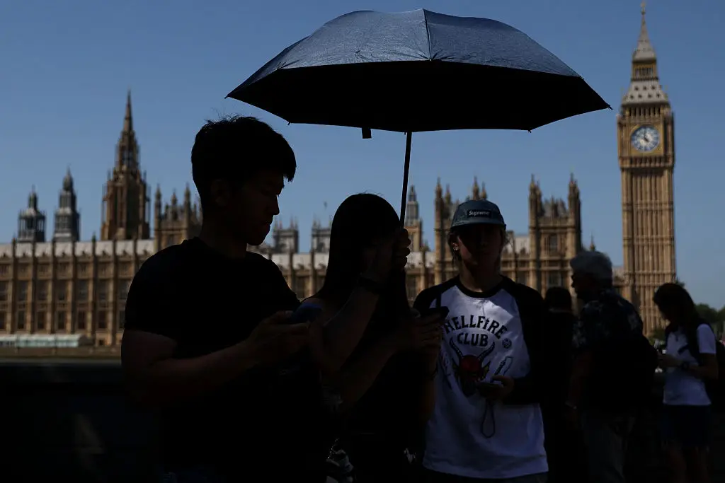 It is going to be incredibly hot in the UK this week, but there is no maximum temperature that makes it 'too hot to work' (Adrian DENNIS / AFP via Getty Images)