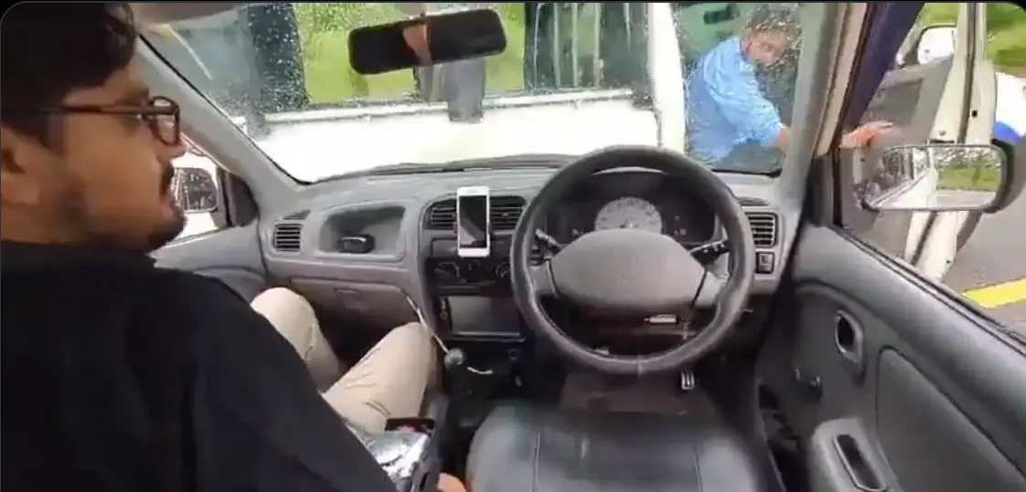 Police were seen looking bemused as the car without a driver smashed into them (X)