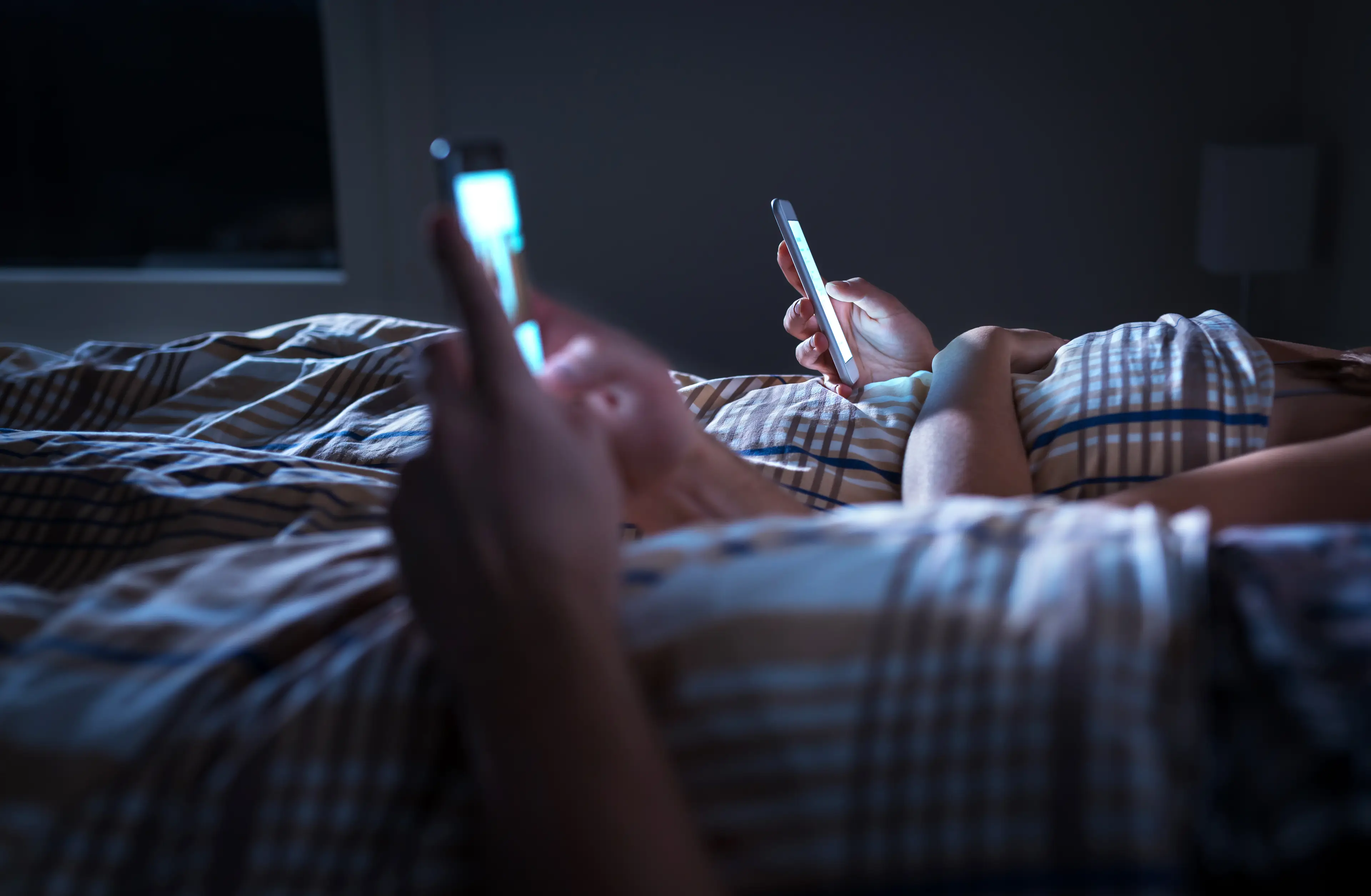 Using your phone in bed may not be the smartest idea (Getty Stock Photo)