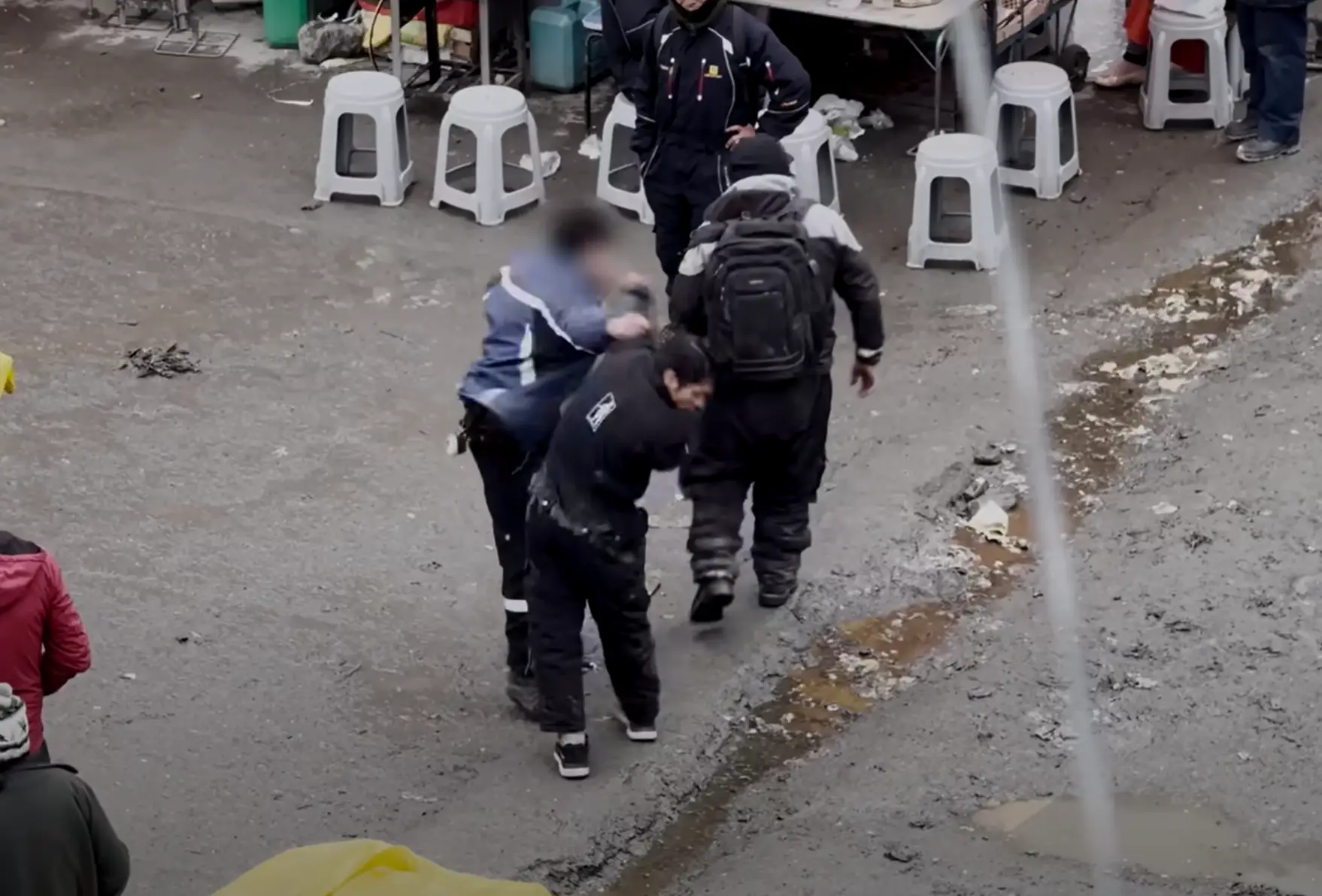 The filmmakers saw numerous fights going on outside their window. (YouTube / Yes Theory)