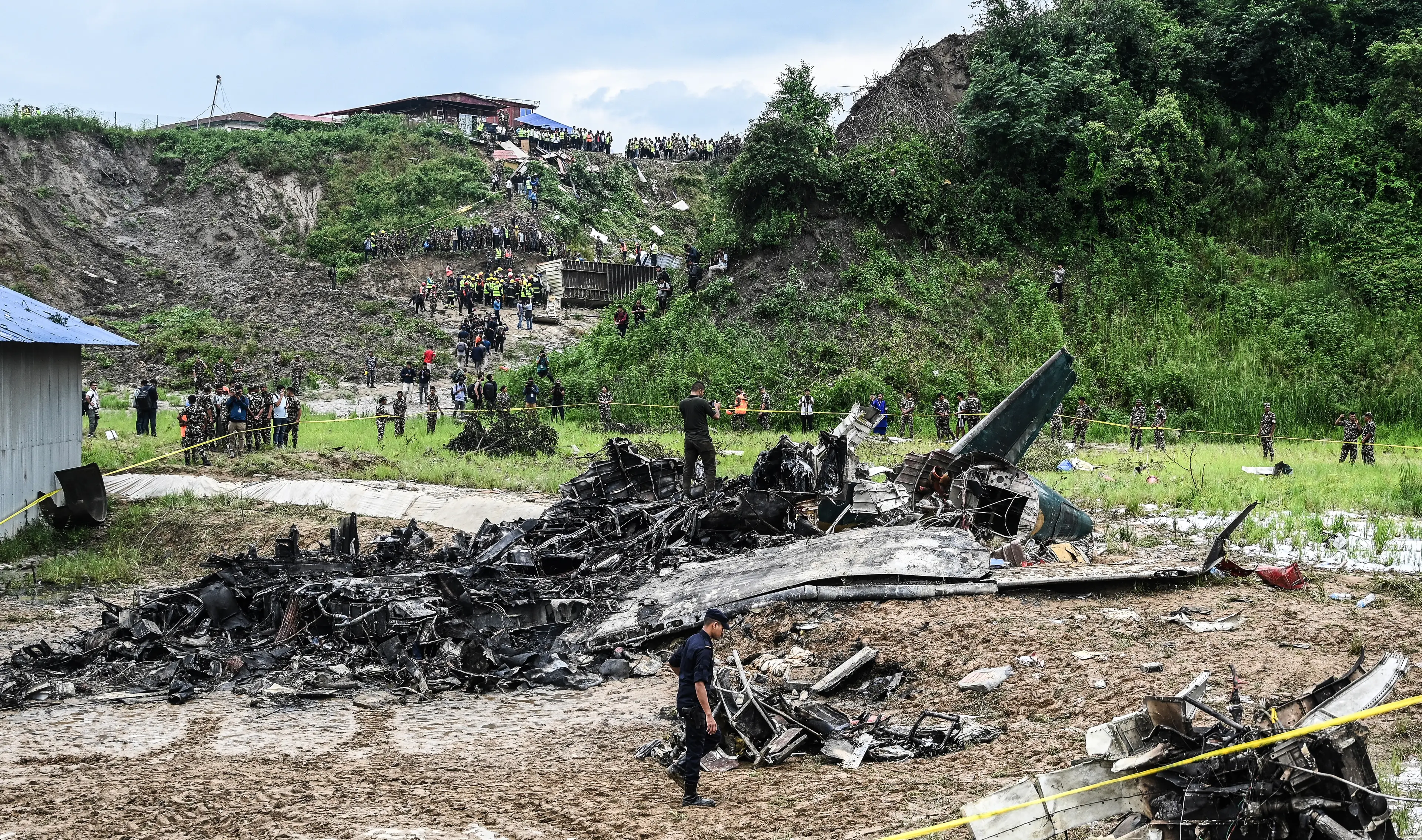 18 bodies have been retrieved from the charred wreckage of the Saurya Airlines plane (PRAKASH MATHEMA/AFP via Getty Images)