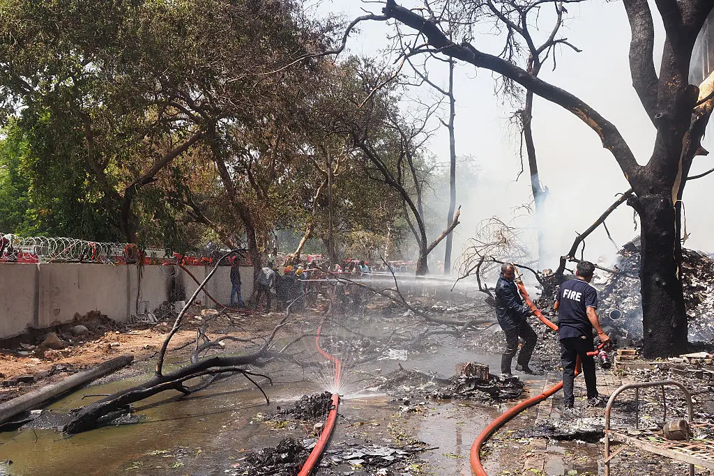Emergency services are on the scene of the crash, as the 787 hit a medical college hostel  (SAM PANTHAKY/AFP via Getty Images)