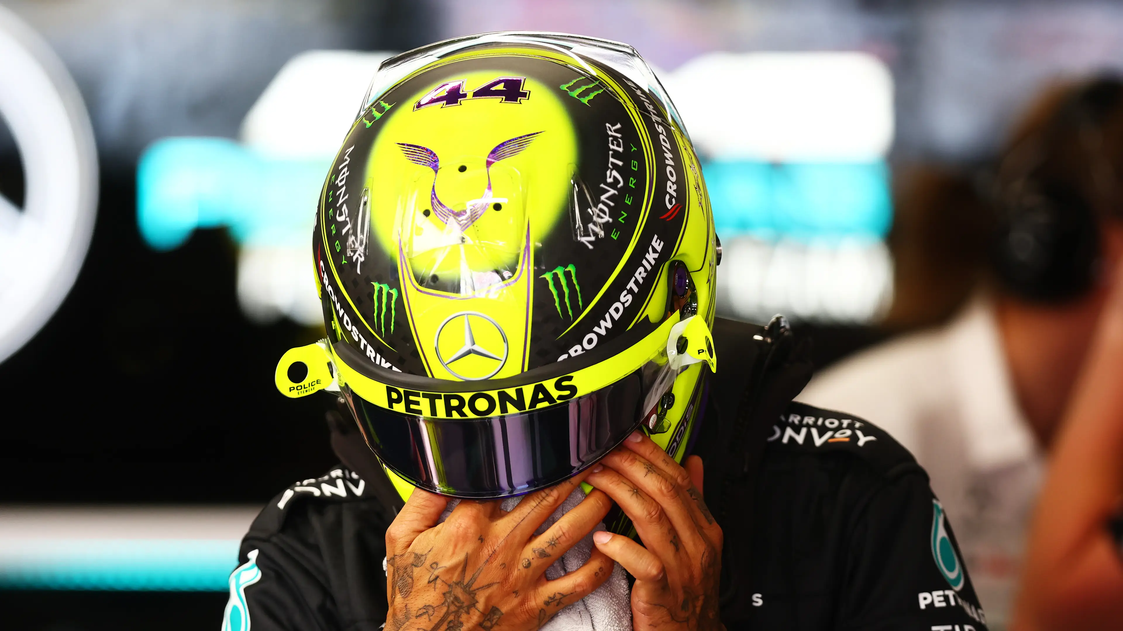 Hamilton's race number #44 can be seen on the top of his helmet.