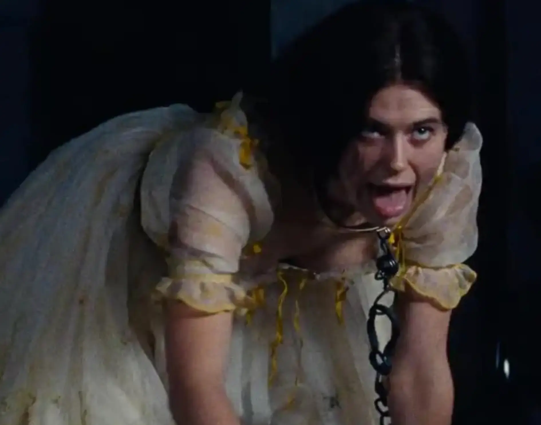 The character seems to be willingly going along with Heathcliffe's game rather than a victim of abuse. (Warner Bros. Pictures)