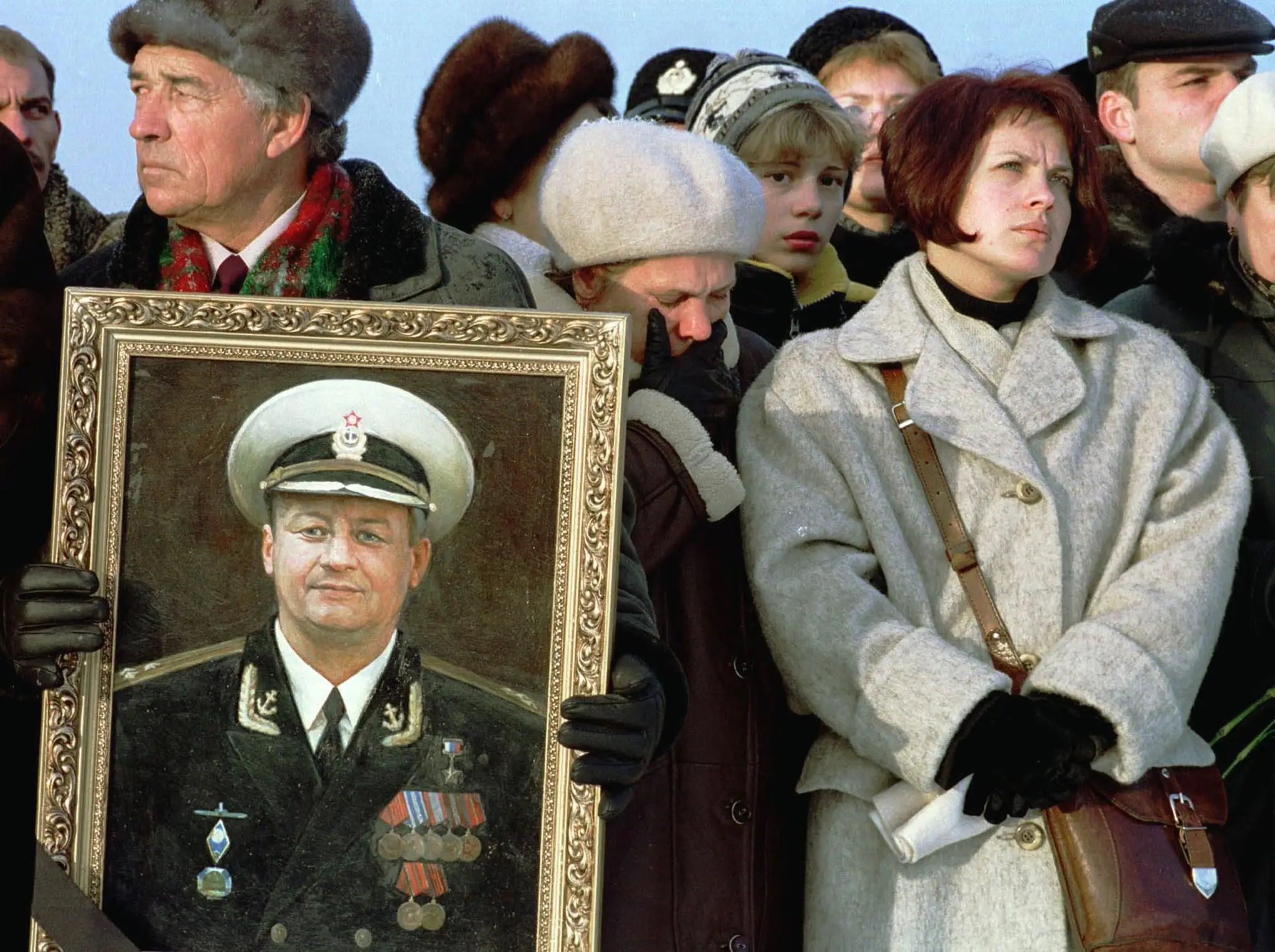 The wife of Captain-Lieutenant Dmitri Kolesnikov pictured during a memorial ceremony (AFP via Getty Images)
