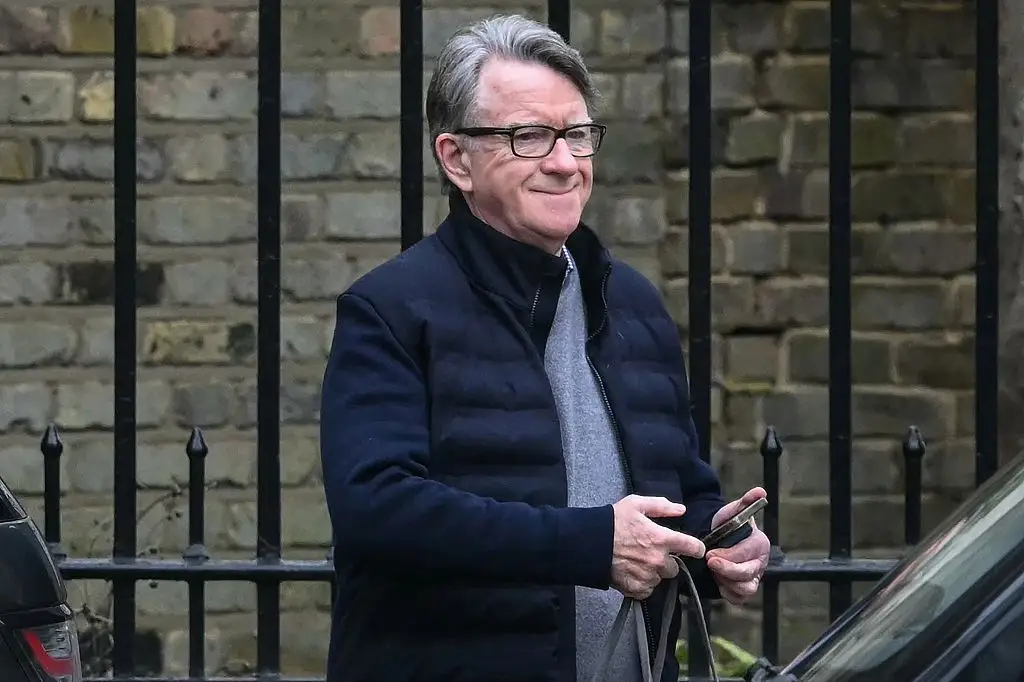 Mandelson pictured leaving his house as he was arrested this afternoon (JUSTIN TALLIS / AFP via Getty Images)