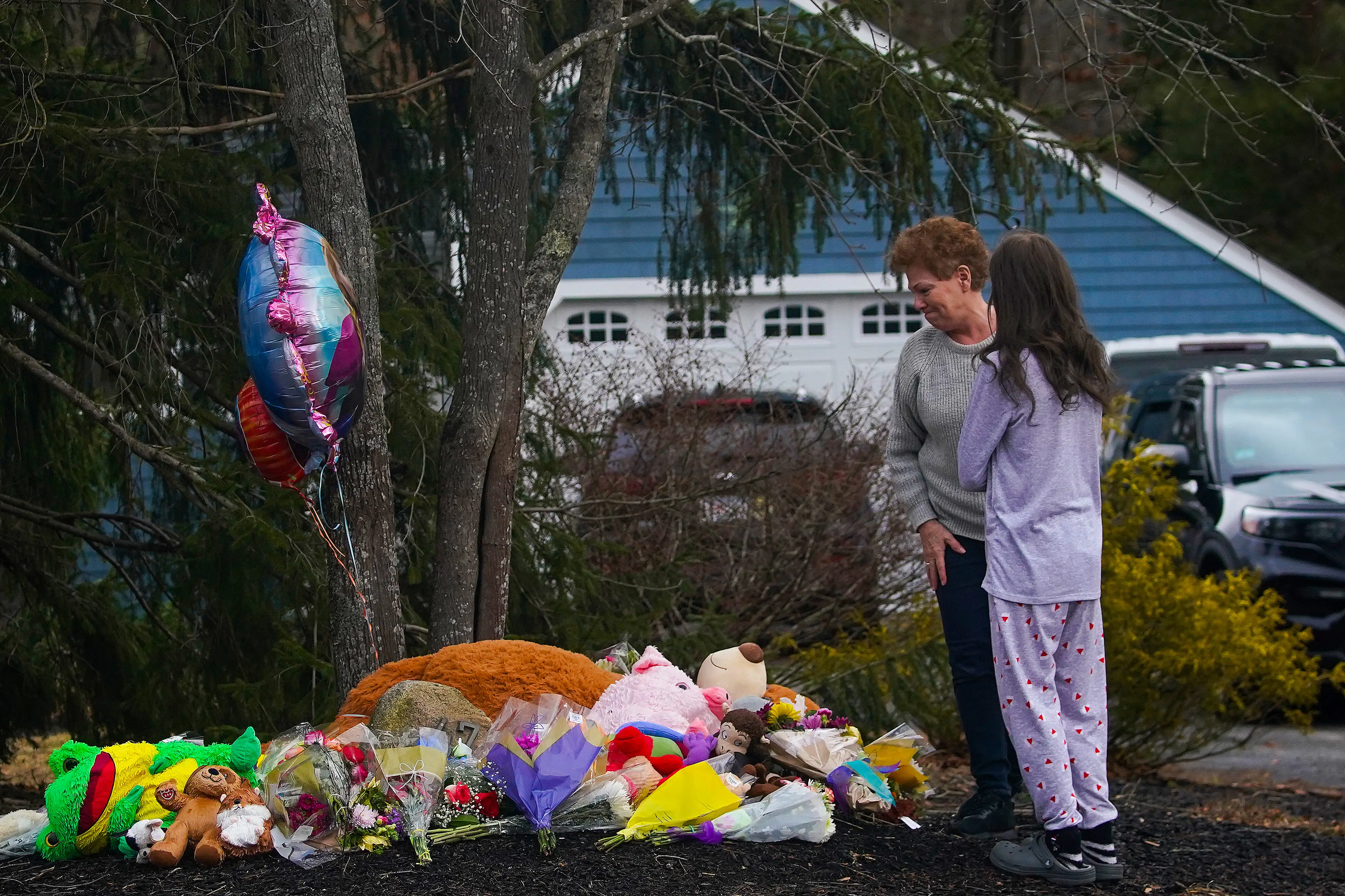 Tributes left outside the Clancy home to siblings Cora, five, Dawson, three, and eight-month-old Callan in 2023 (Barry Chin/The Boston Globe via Getty Images)