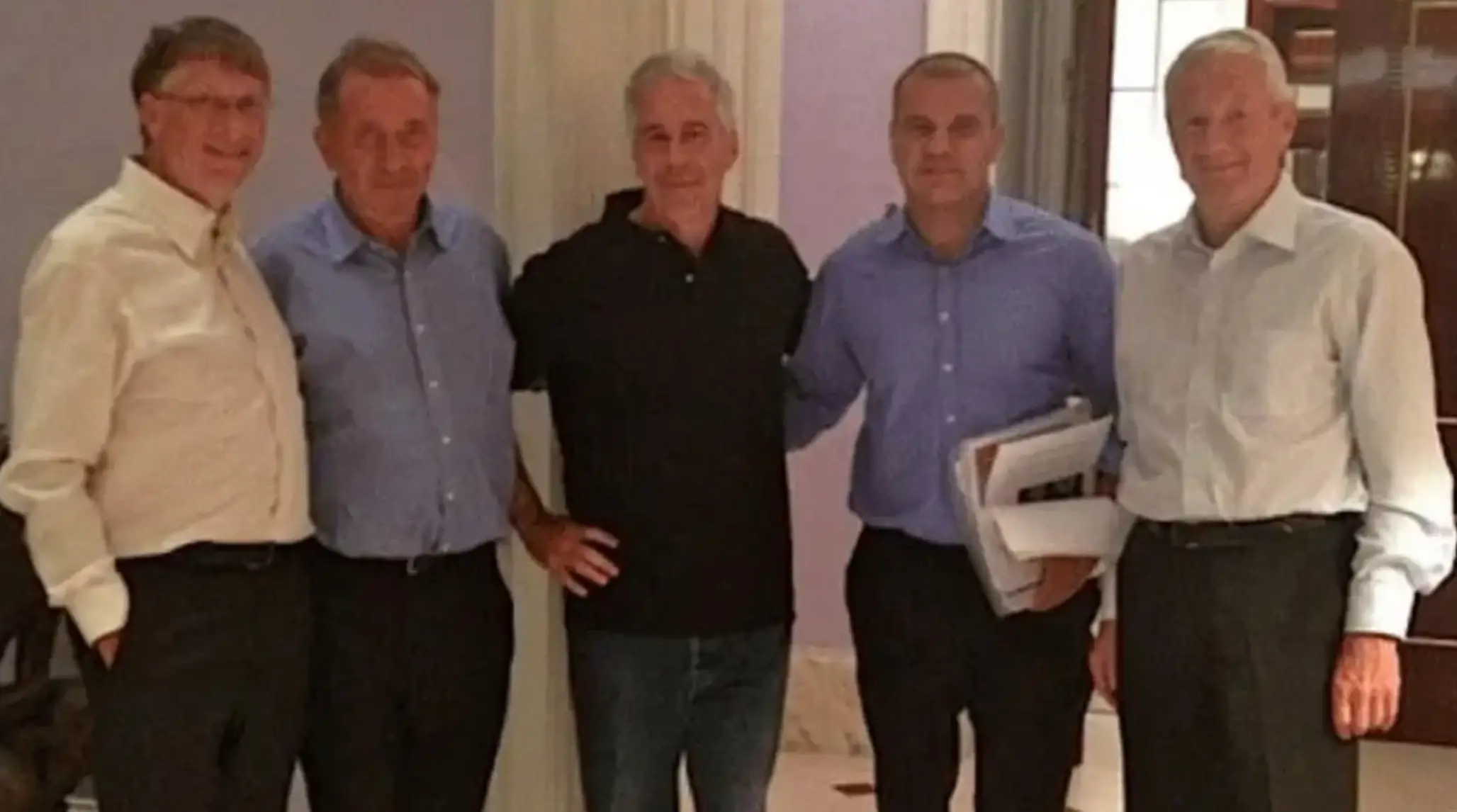 Bill Gates (far left) photographed with Jeffrey Epstein (DoJ)