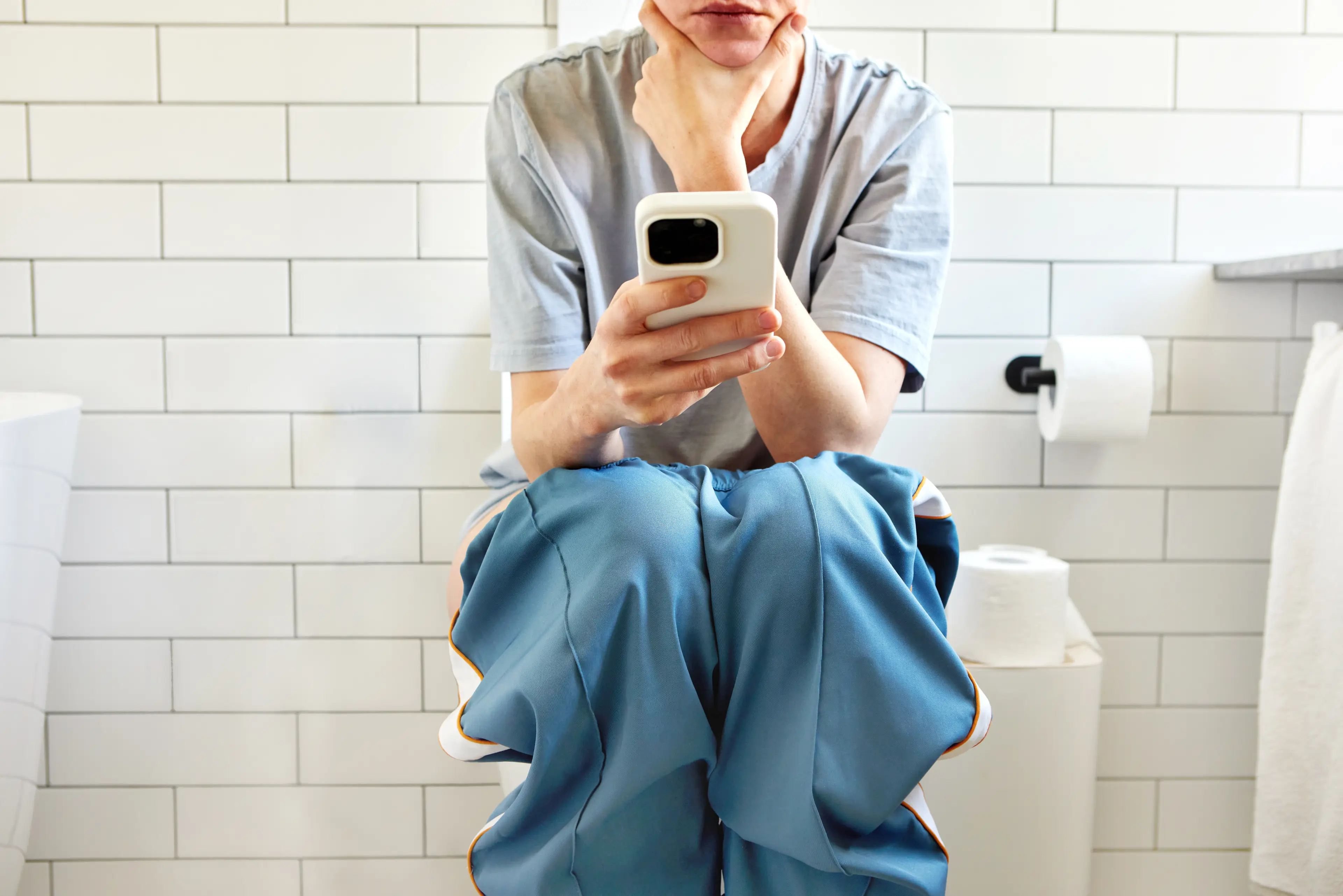 Scrolling while on the toilet could harm your health (Getty Stock)