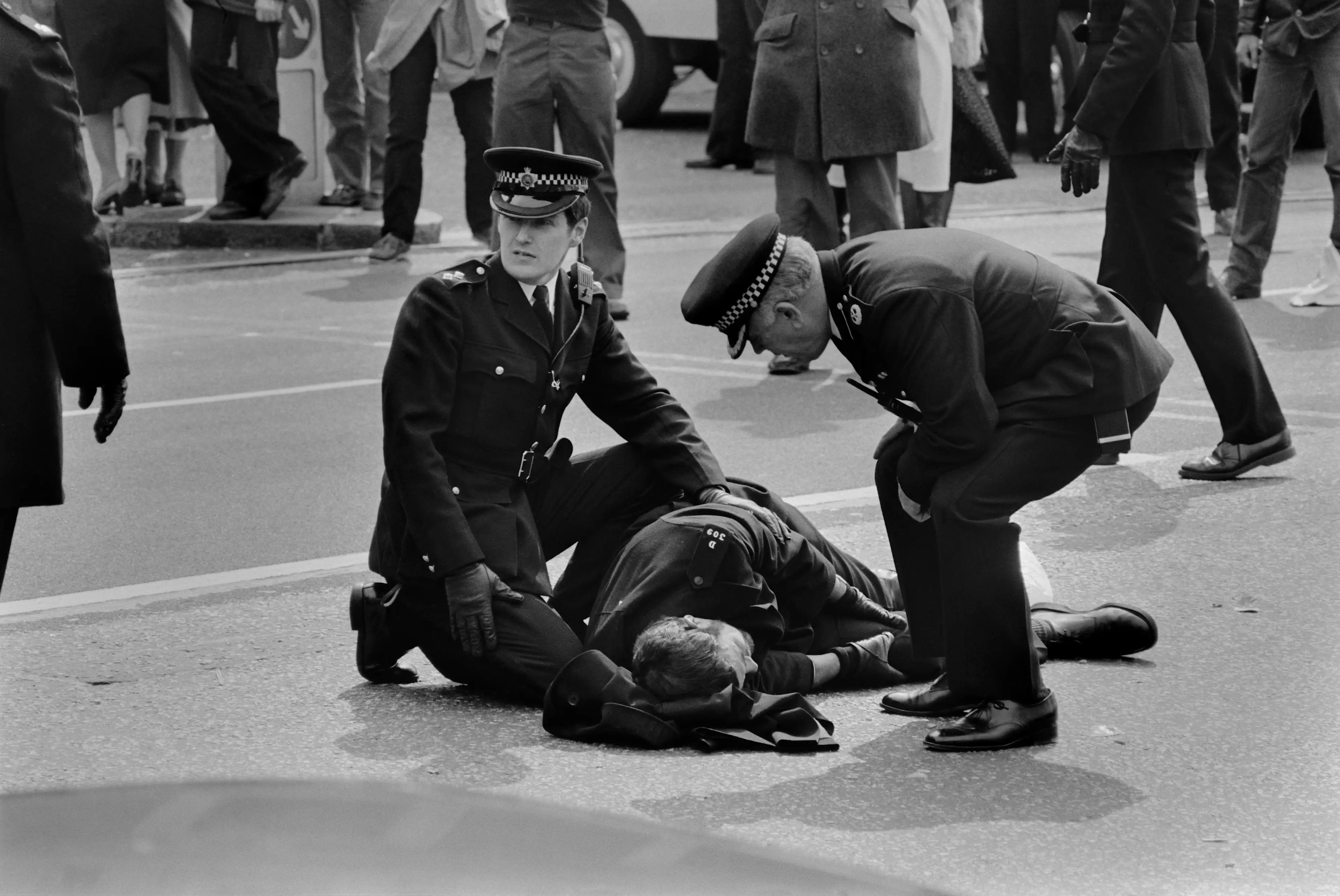 An officer injured during the siege. The images shown in Traces of Death would not be legal to show in this article (Central Press/Hulton Archive/Getty Images)