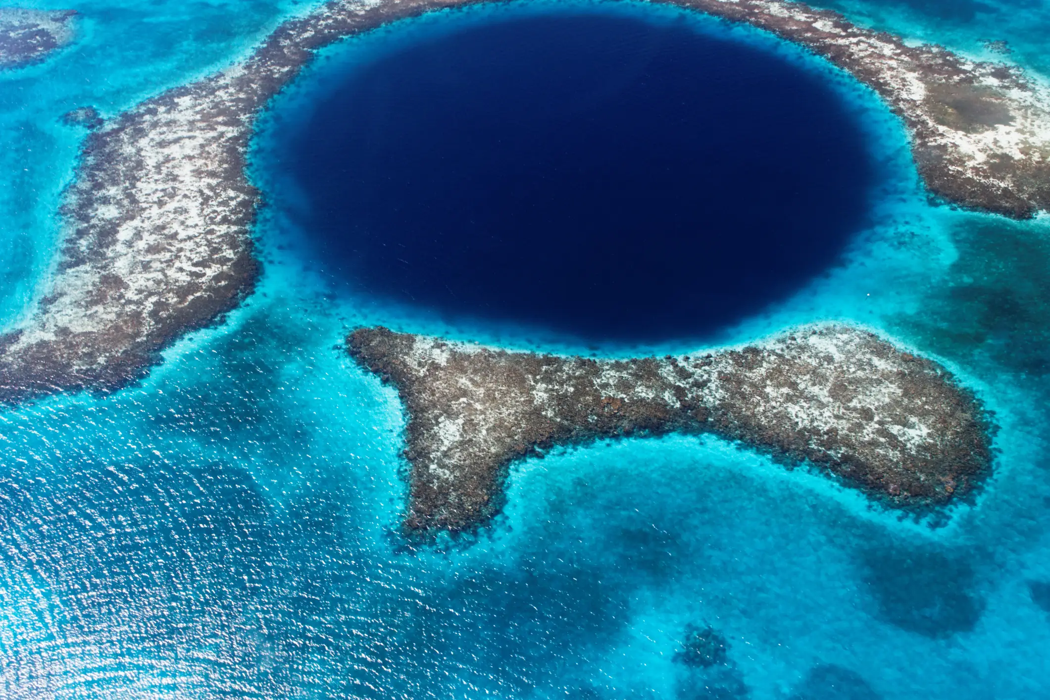 The Great Blue Hole is located off the coast of Belize in Central America, near the centre of Lighthouse Reef (Getty Stock Images)