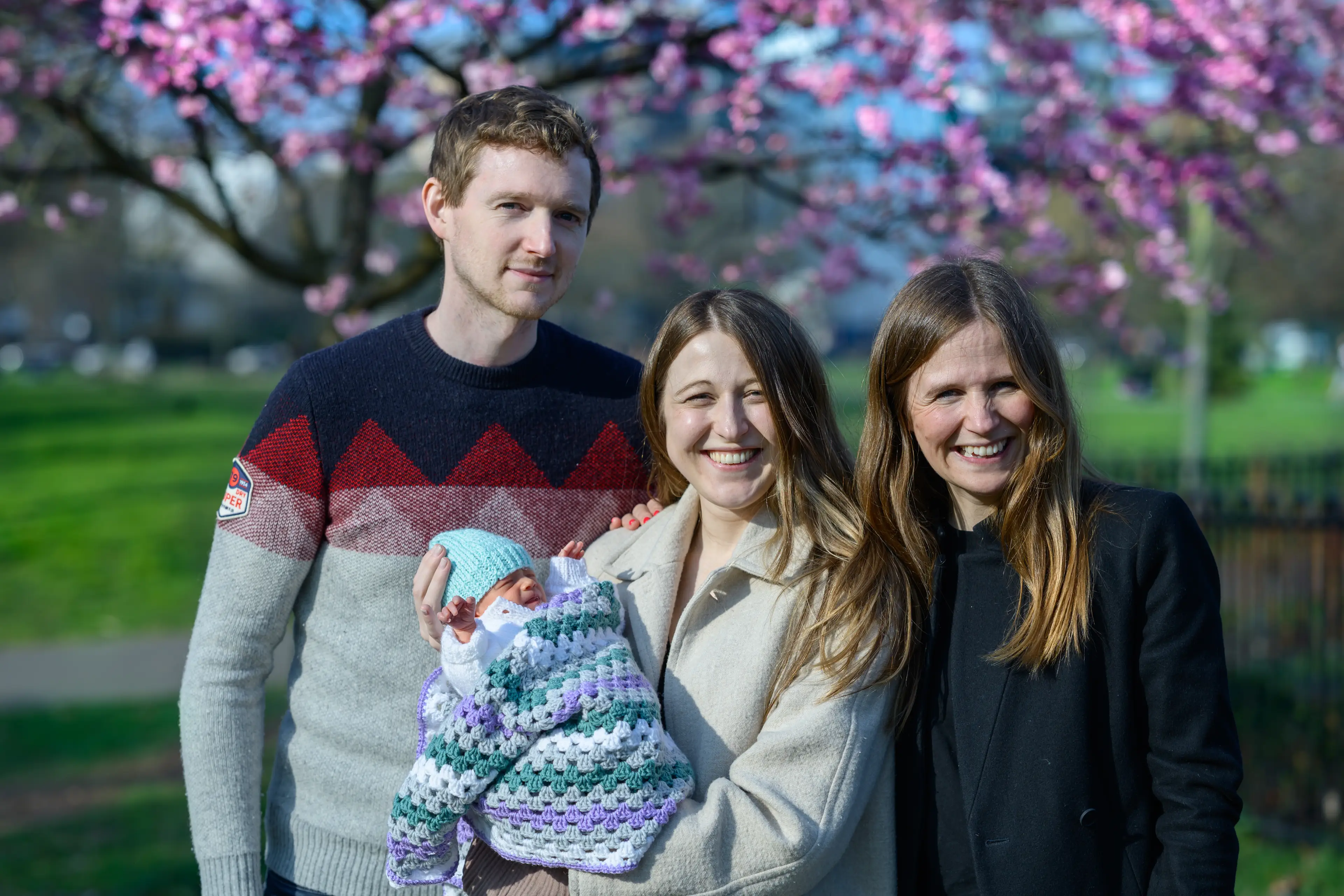 Grace Davidson and her husband Angus with their daughter and Grace's older sister Amy (PA)