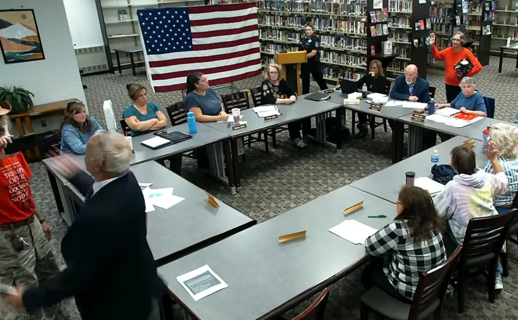 Eventually things descended to a point where a man tried to knock the phone out of Bodnar's hand (YouTube/Regional School Unit 67)