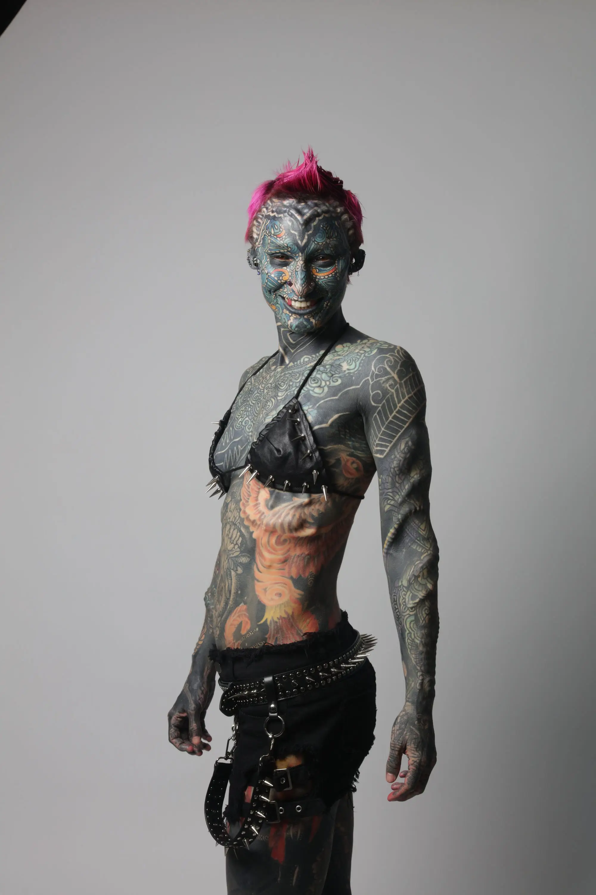 The former medical service officer, 36, has 99.8% of her skin covered in ink as well as 89 body modifications (SWNS)