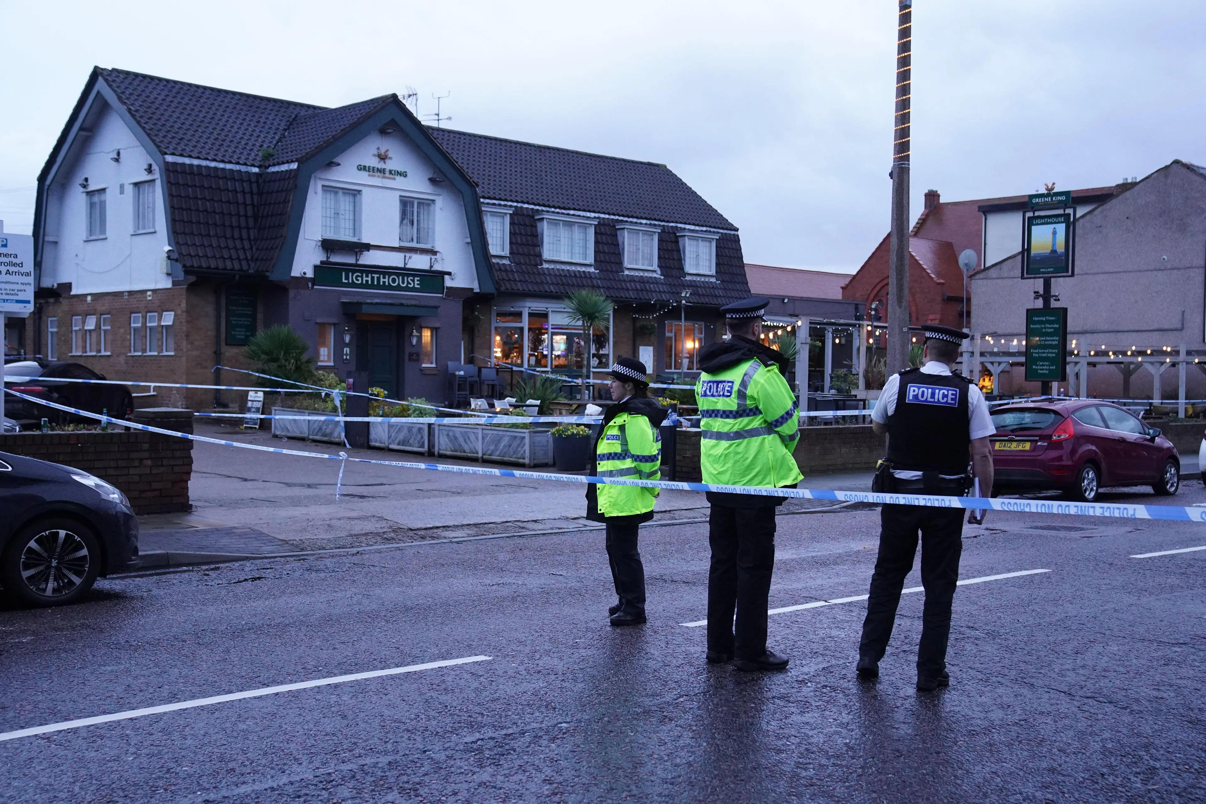 Police outside The Lighthouse Pub in Wallasey Village.