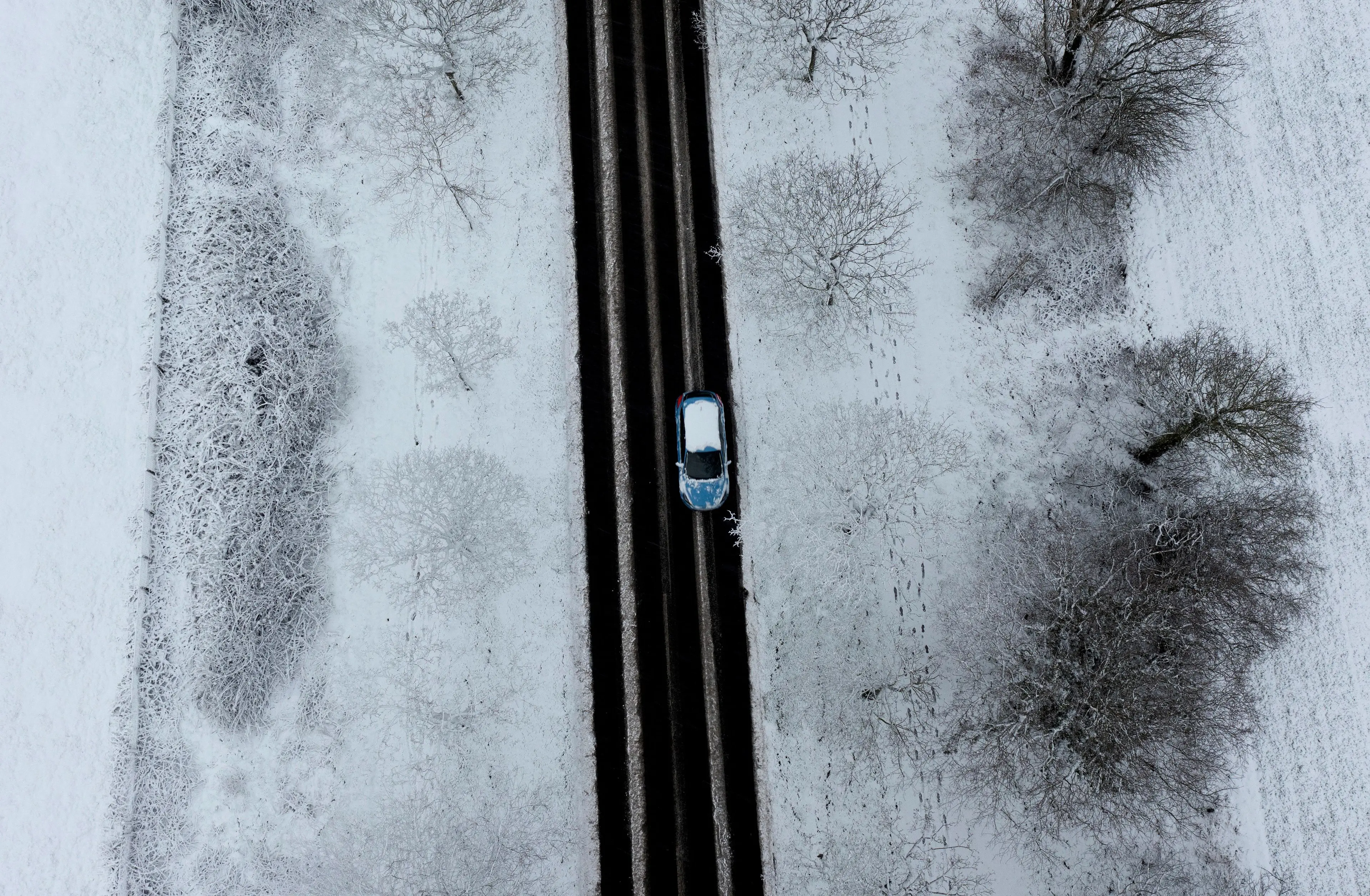 Even if there's only a little bit of snow you'll want to get rid of it, or you could get points on your licence. (PAUL ELLIS/AFP via Getty Images)