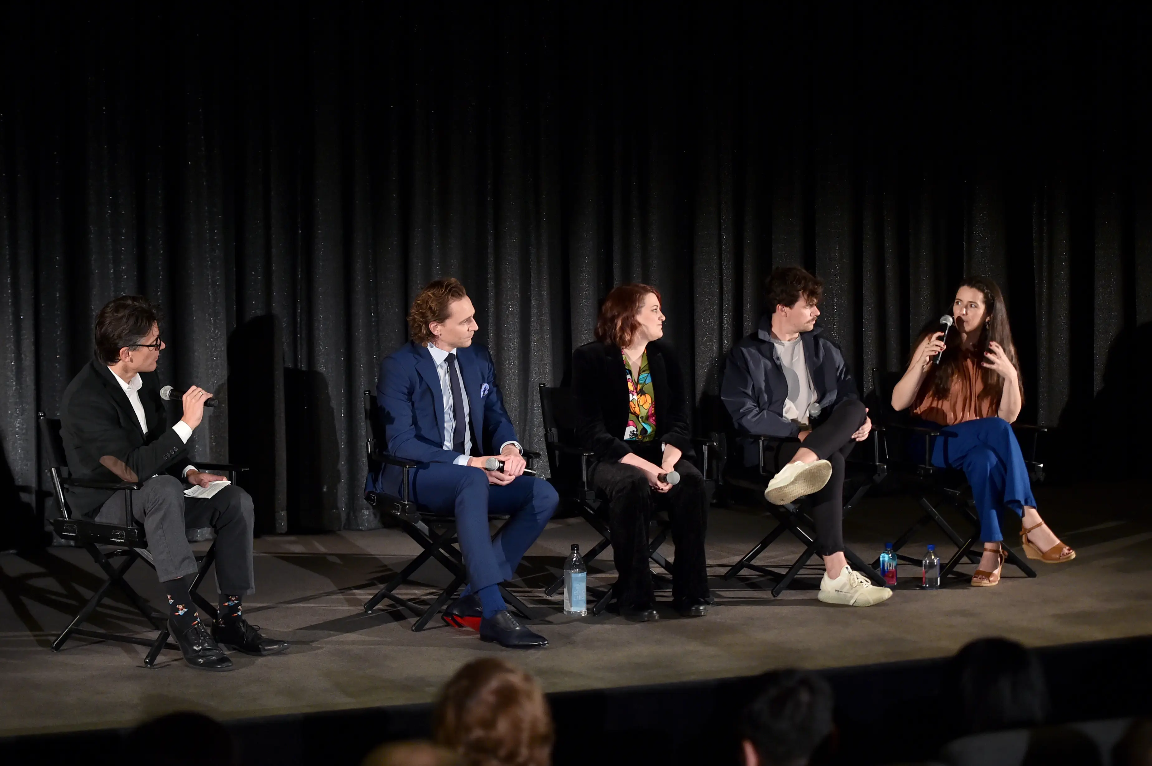 Natalie Holt speaking at a Loki FYC event alongside Tom Hiddleston, director Kate Herron, and writer Michael Waldron (Alberto E. Rodriguez/Getty Images for Disney)