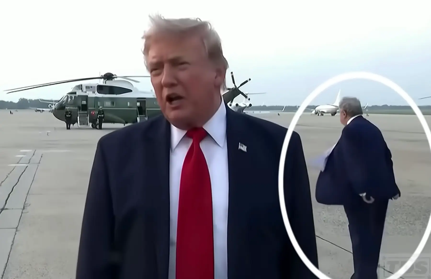 A bloke who appeared to be the double of Donald Trump was seen lurking behind him during the interview (YouTube/The Daily Show)