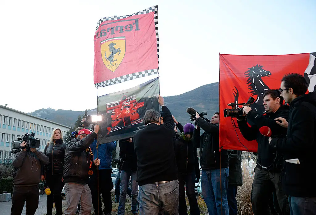 Fans gathered outside the hospital to show their support (PHILIPPE DESMAZES/AFP via Getty Images)