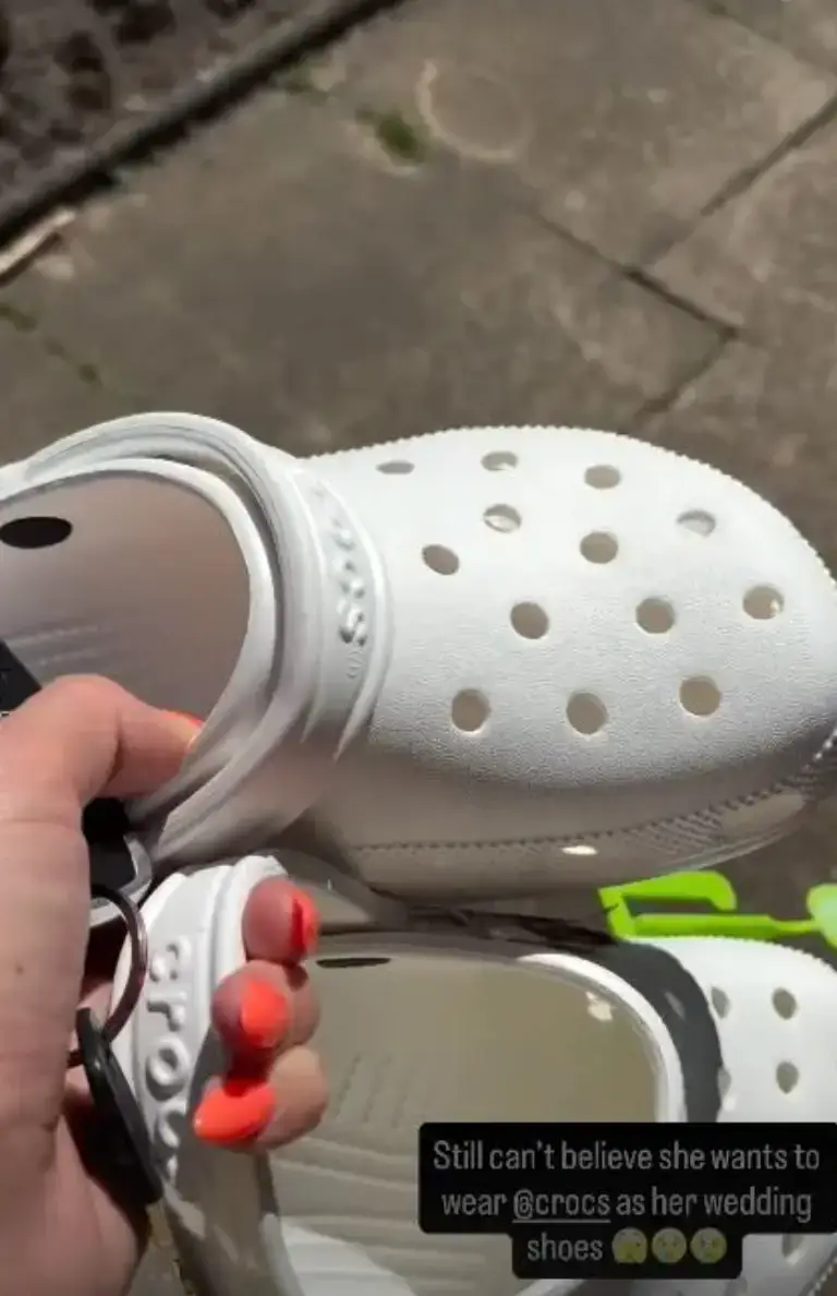 Paris filmed herself holding a pair of white Crocs ahead of her daughter's wedding (Instagram/@paris.fury1)