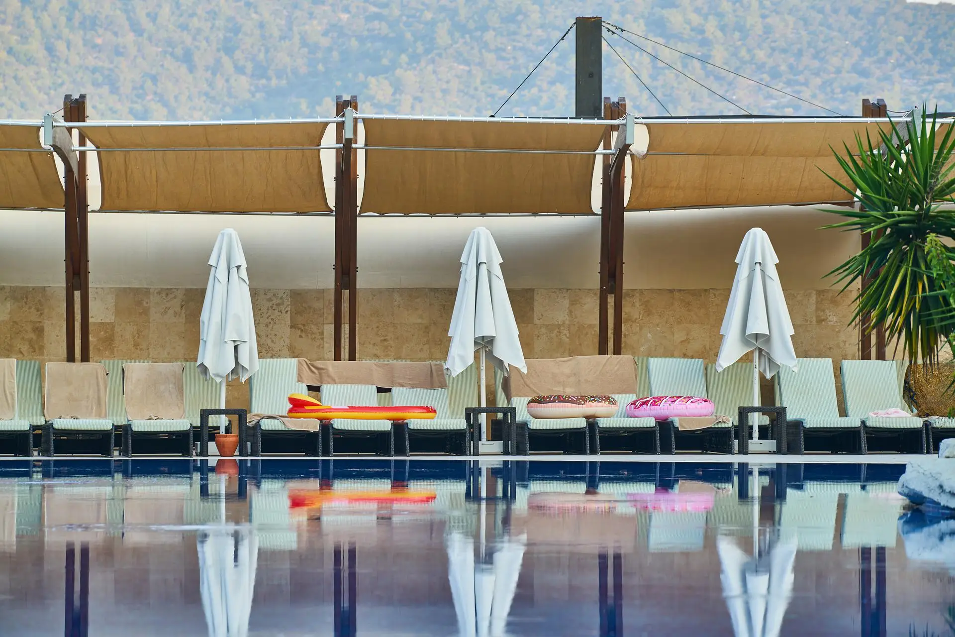Tourists use towels to save their sunbeds for later in the day.