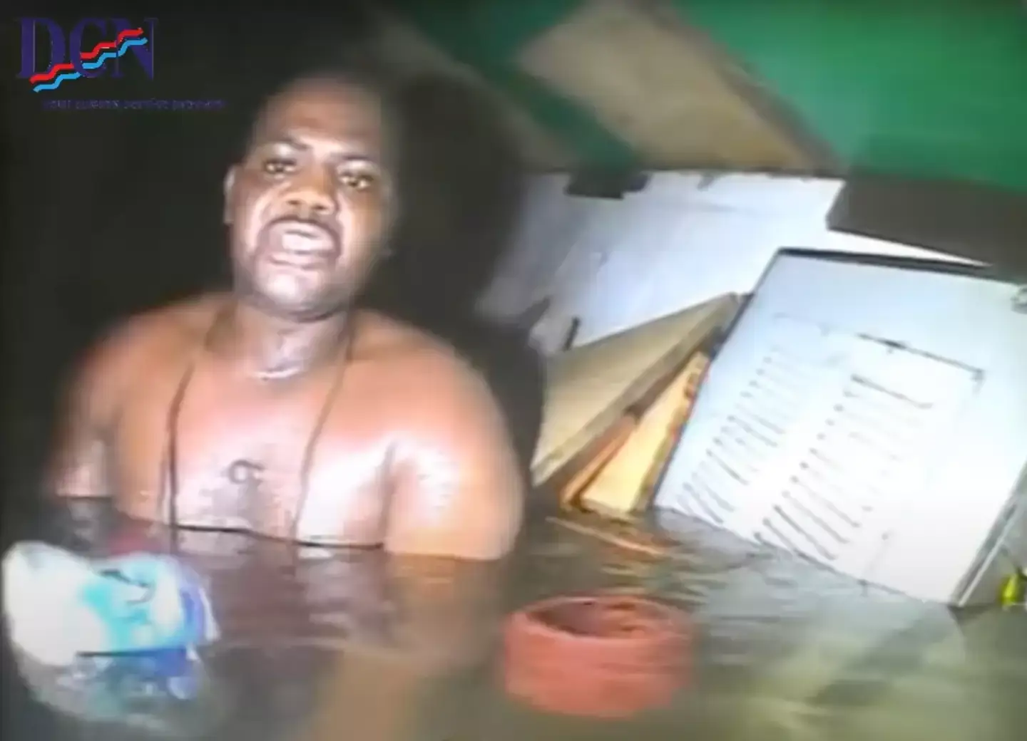 He was stuck in a pocket of air, submerged by debris. (YouTube/DCN Diving)
