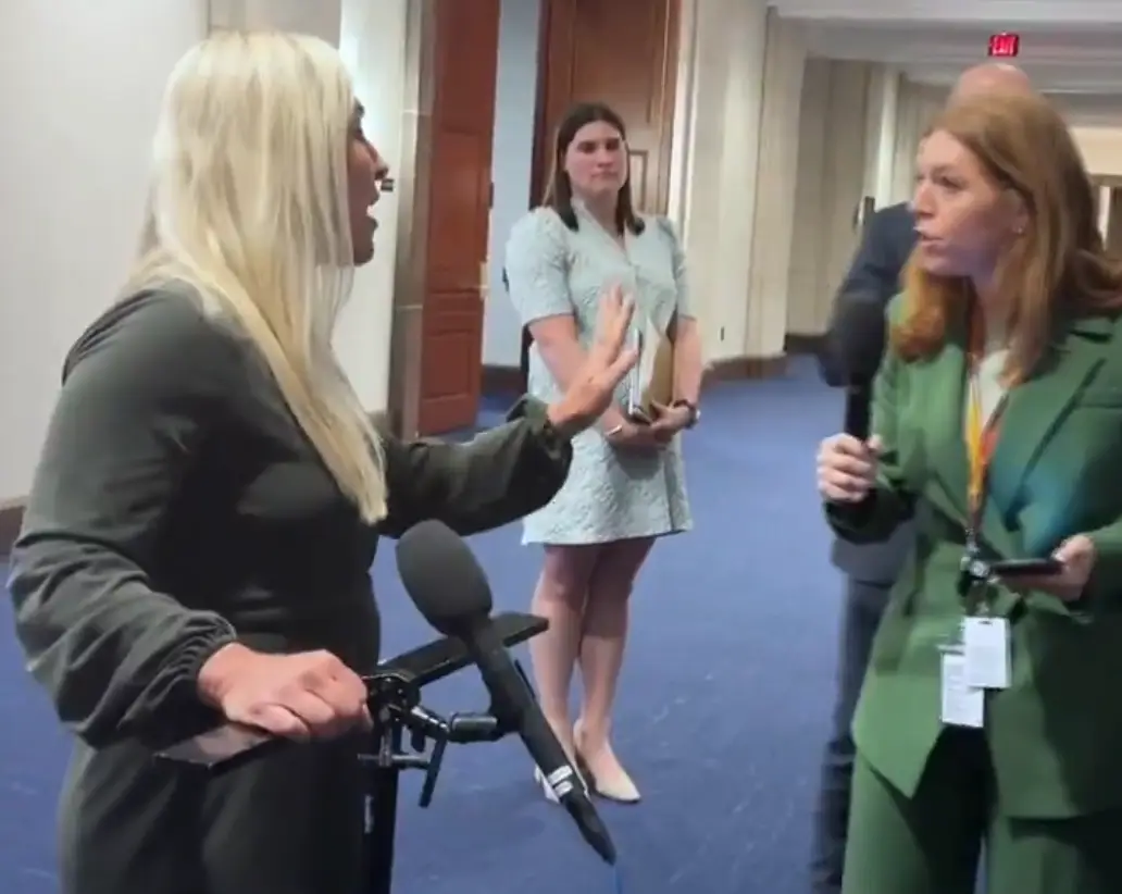 Greene refused to take questions from the reporter and told her to 'go back to her own country' (Sky News)