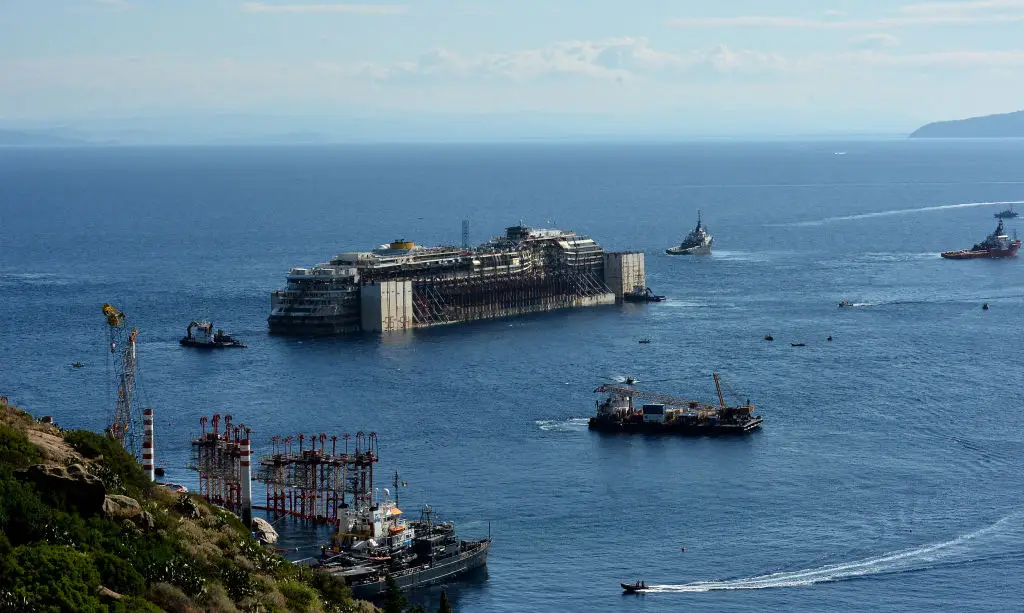 The Costa Concordia being towed away for scrapping after being refloated (TIZIANA FABI/AFP via Getty Images)