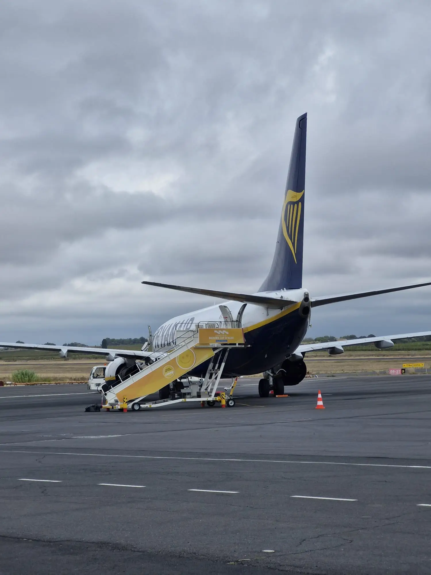 Our delayed flight on Beziers Airport runway while an engineer was being flown out from Italy to examine the issue (LADbible)