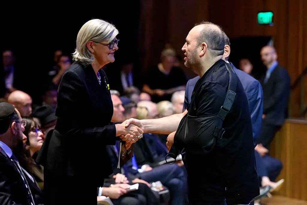 Ahmed Al Ahmed (right) was injured as he intervened in the Bondi Beach massacre (Steven MARKHAM / AFP via Getty Images)