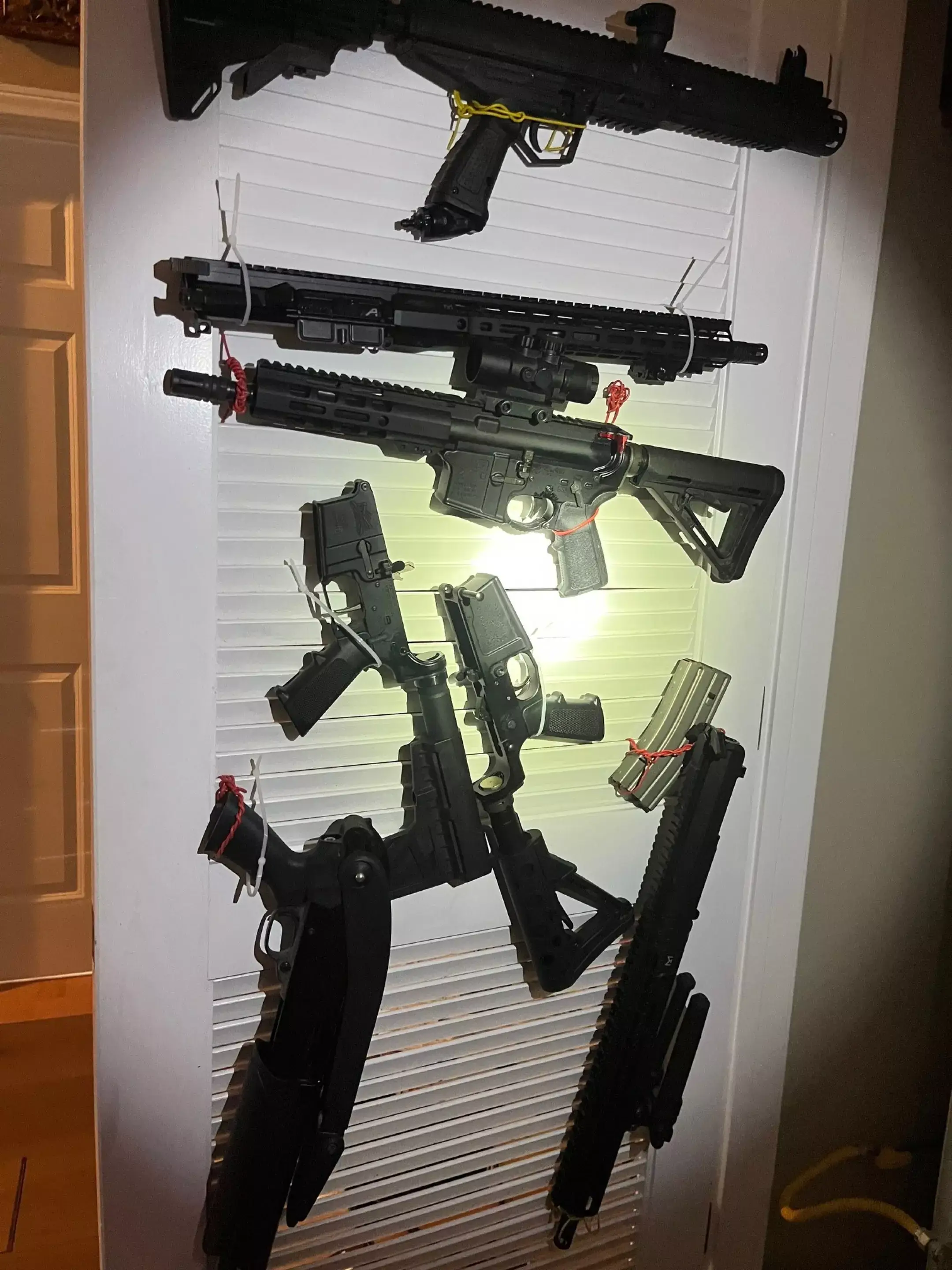 Some of the guns found in her home were loaded, whilst others were unregistered 'ghost guns' (US District Court)