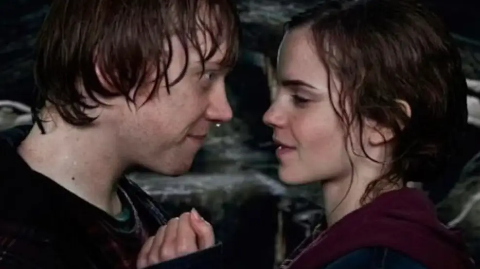 Watson and Grint's characters finally act on their feelings in the final Harry Potter film (Warner Brothers)