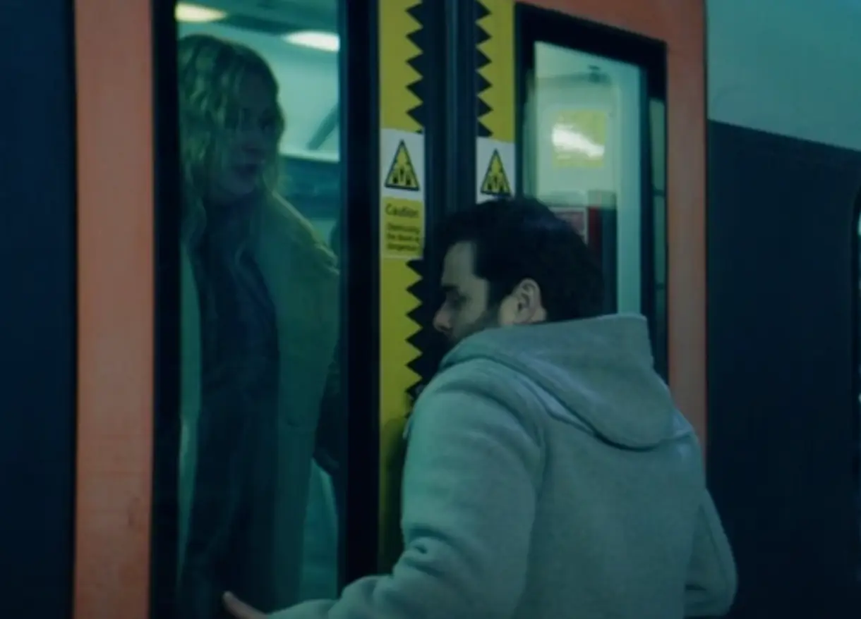 The man's jacket gets caught in the train (BBC)